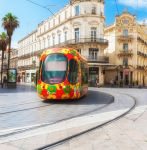 Un caratteristico tram multicolore a Montpellier, Francia: la città ha 4 linee di tram e 84 stazioni - © Bborriss.67 / Shutterstock.com