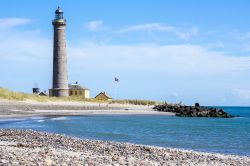 Un faro a Skagen, Danimarca. Dal 1850 questo faro, Grafyr, indica la via ai naviganti.
